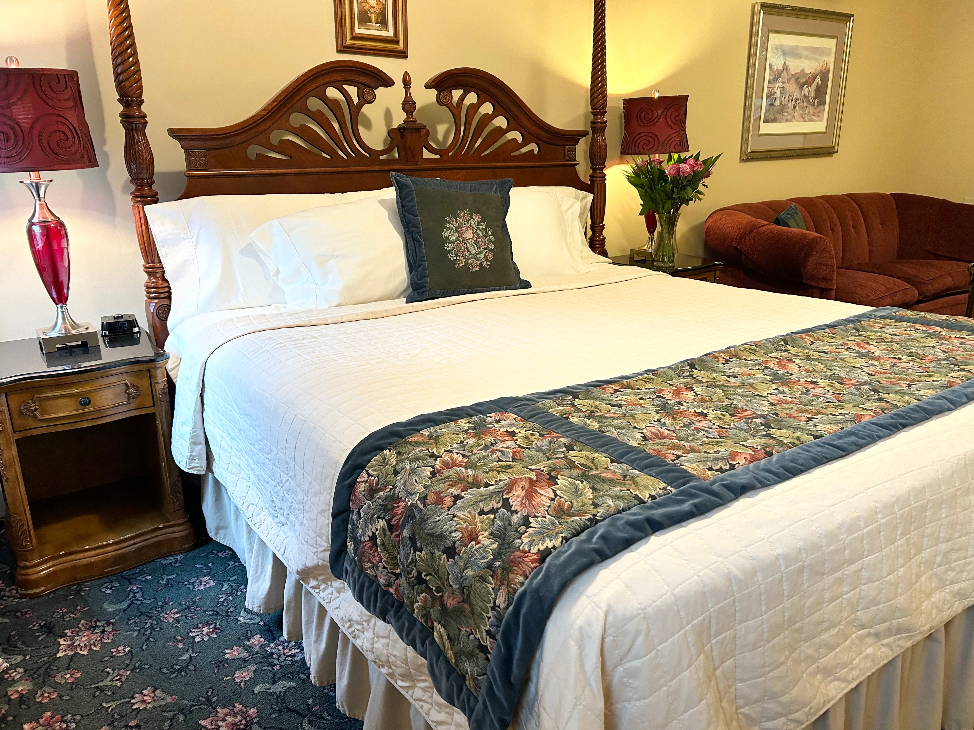 King bed with couch and table sitting area